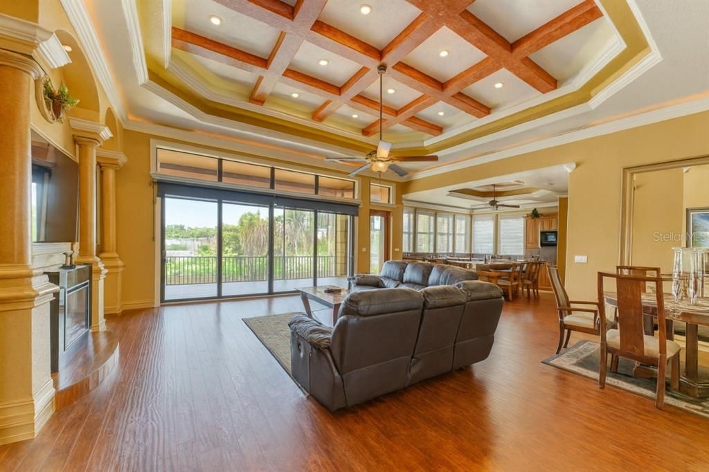 Dining room, Fireplace, Interior, Living room, Recessed Lighting, Wooden Beams, Wood Texture Flooring