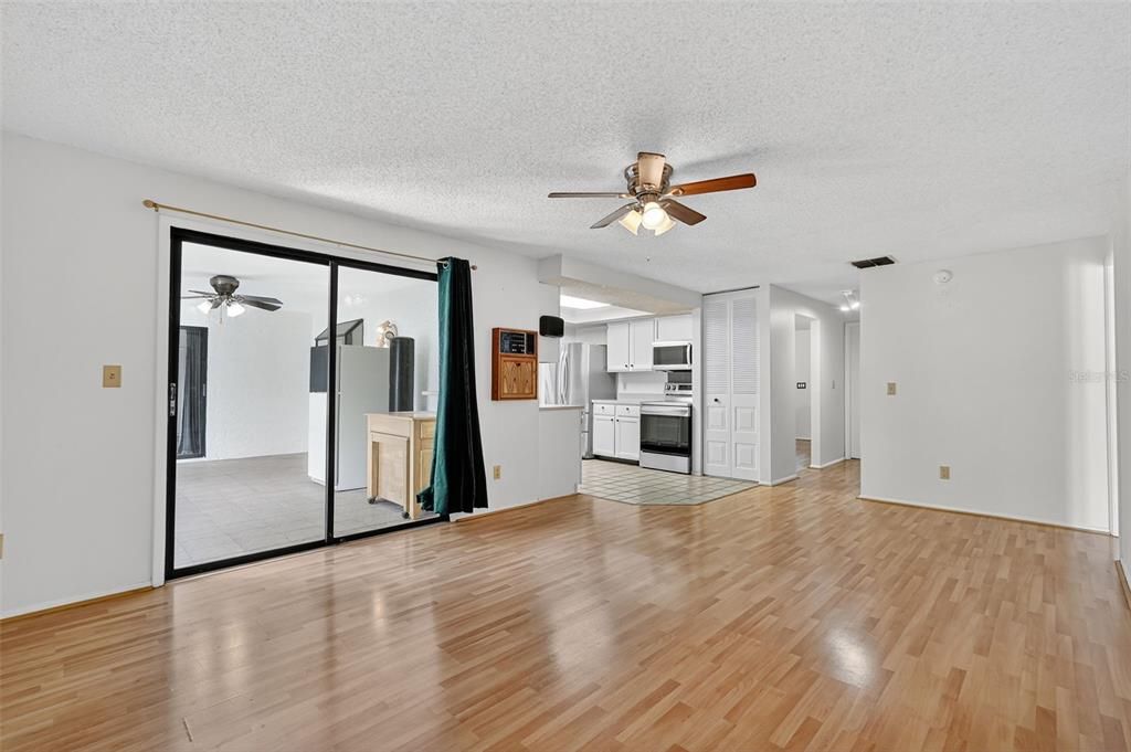 Empty room, Interior, Kitchen, Stainless Steel Appliances, Wood Texture Flooring