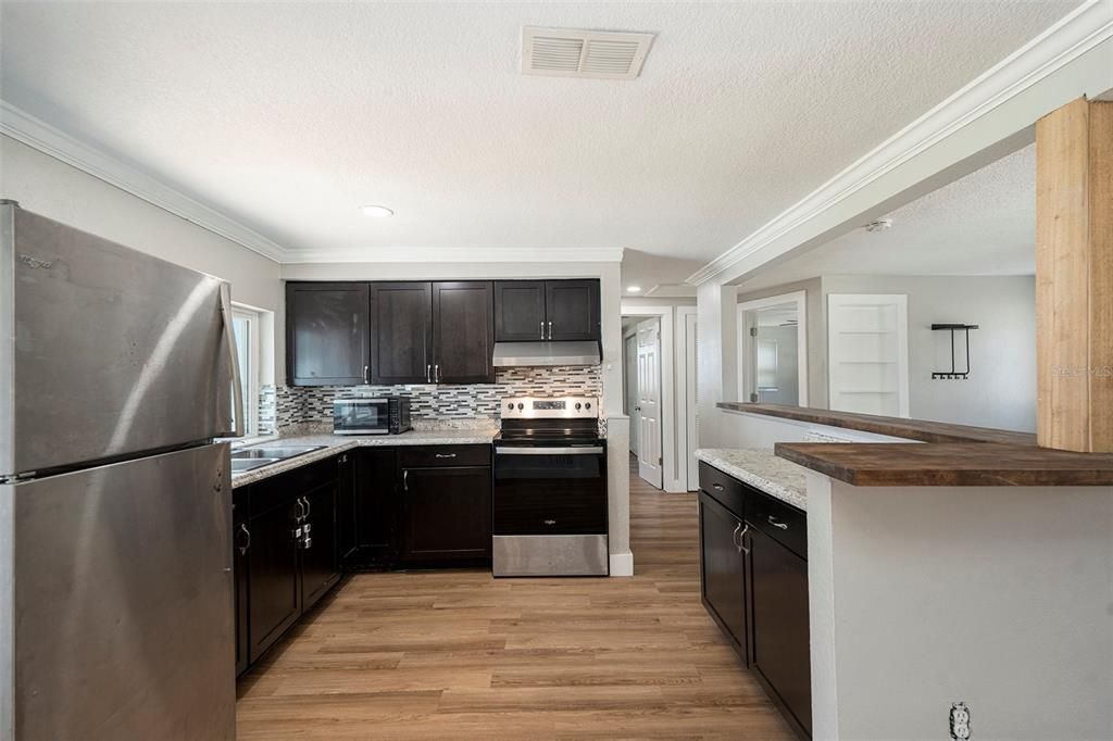 Interior, Kitchen, Recessed Lighting, Stainless Steel Appliances, Wood Texture Flooring