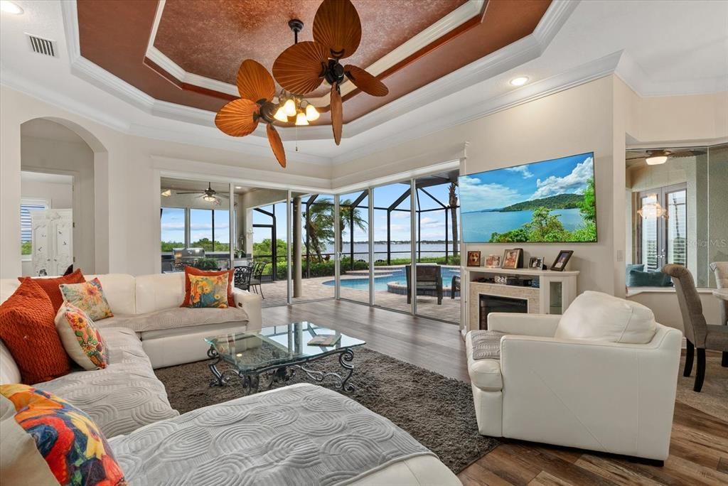 Fireplace, Interior, Living room, Recessed Lighting, Water, Wood Texture Flooring