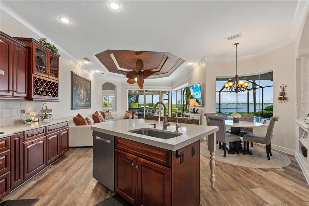 Chandelier, Dining room, Interior, Kitchen, Living room, Recessed Lighting, Water, Wood Texture Flooring