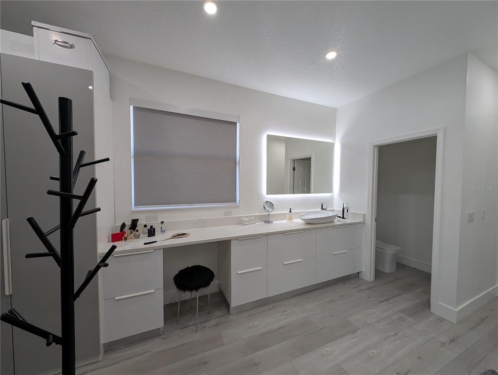 Bathroom, Dual Sink Vanities, Interior, Recessed Lighting, Wood Texture Flooring