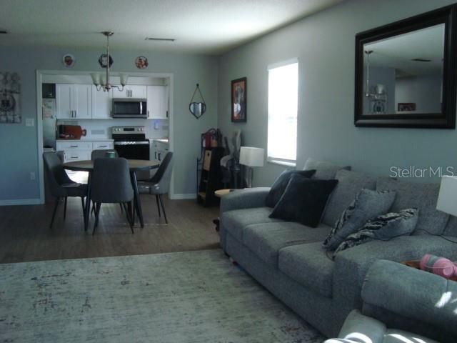 Dining room, Interior, Kitchen, Living room, Pendant Lights, Stainless Steel Appliances, Wood Texture Flooring