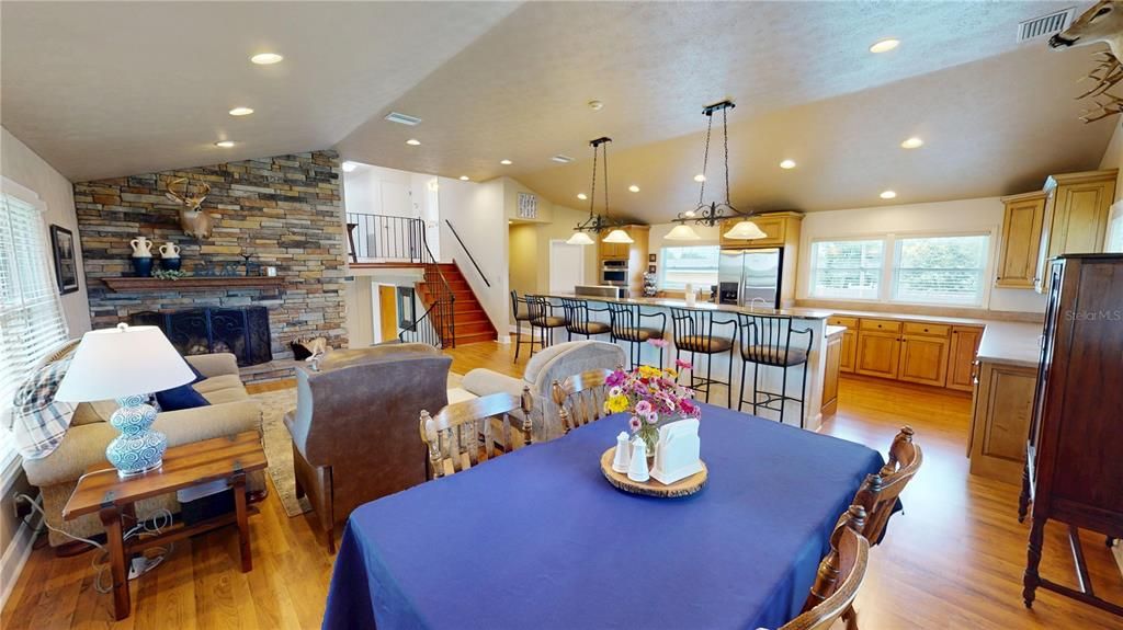 Dining room, Fireplace, Interior, Kitchen, Living room, Pendant Lights, Recessed Lighting, Stone Walls, Wood Texture Flooring