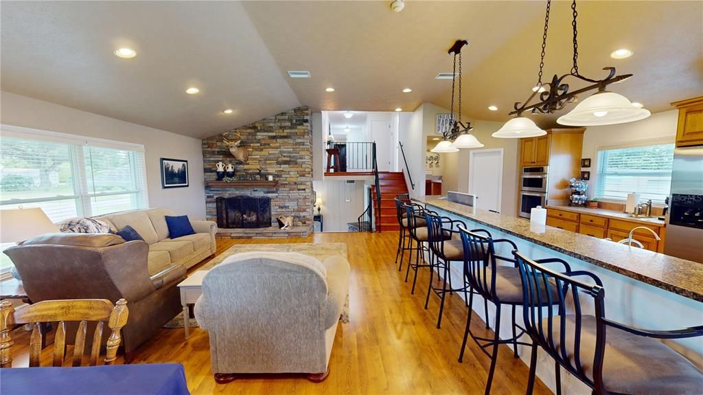 Fireplace, Interior, Kitchen, Living room, Pendant Lights, Recessed Lighting, Stone Walls, Wood Texture Flooring