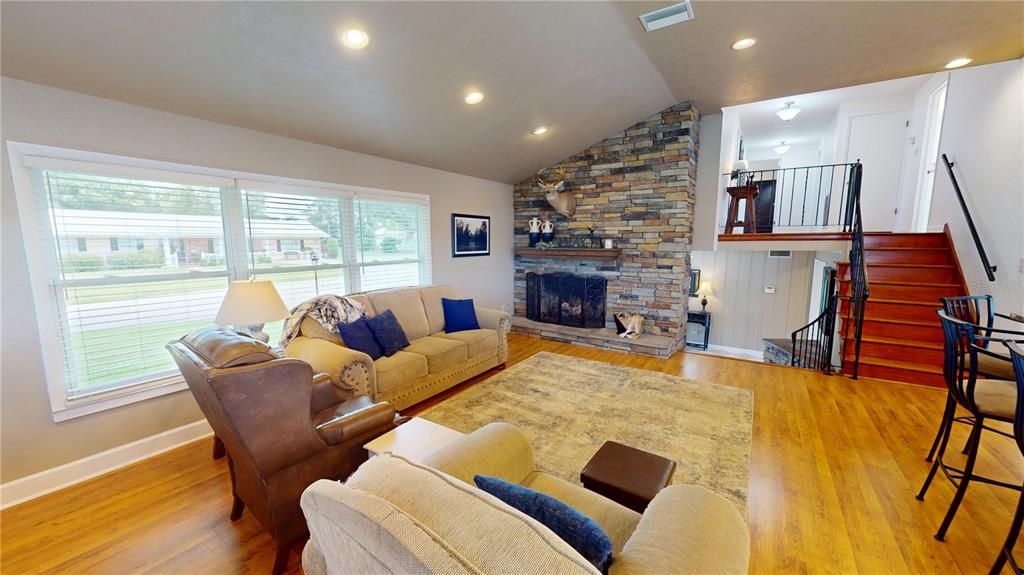 Fireplace, Interior, Living room, Recessed Lighting, Stone Walls, Wood Texture Flooring