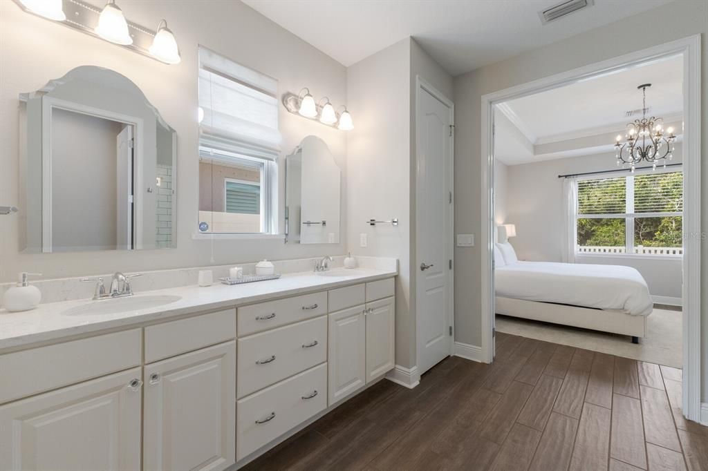 Bathroom, Bedroom, Chandelier, Dual Sink Vanities, Interior, Wood Texture Flooring