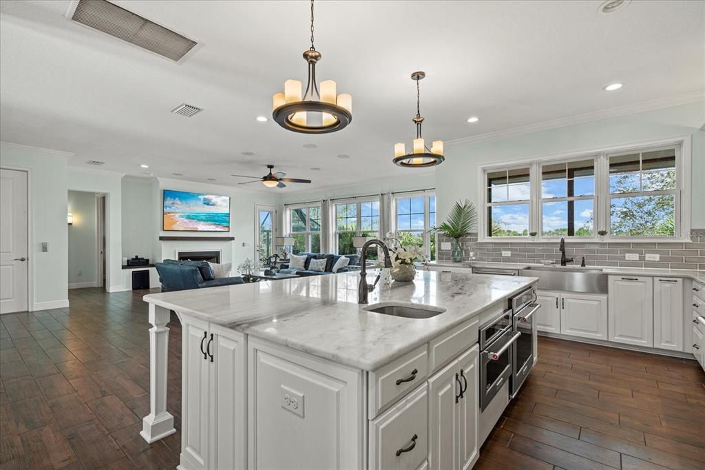 Chandelier, Fireplace, Interior, Kitchen, Pendant Lights, Recessed Lighting, Wood Texture Flooring