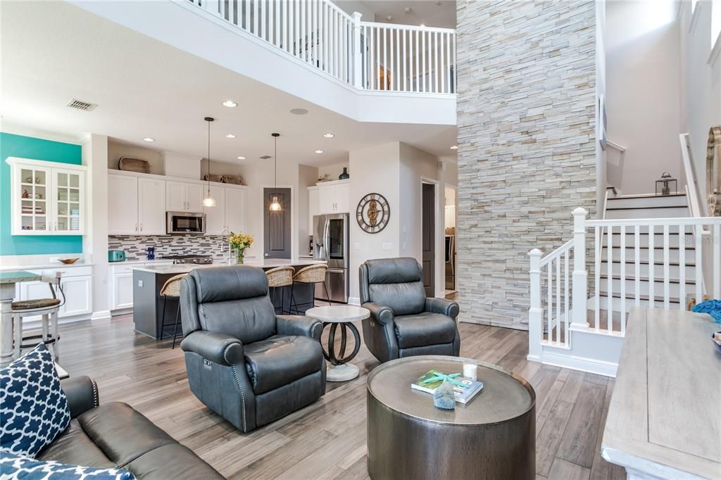 Interior, Kitchen, Living room, Pendant Lights, Recessed Lighting, Stainless Steel Appliances, Stone Walls, Wood Texture Flooring
