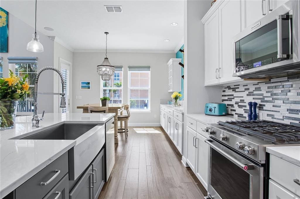 Chandelier, Dining room, Interior, Kitchen, Pendant Lights, Recessed Lighting, Stainless Steel Appliances, Wood Texture Flooring
