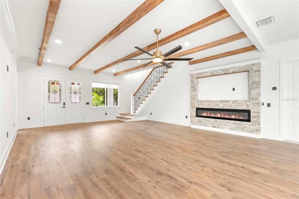 Empty room, Fireplace, Interior, Recessed Lighting, Wooden Beams, Wood Texture Flooring