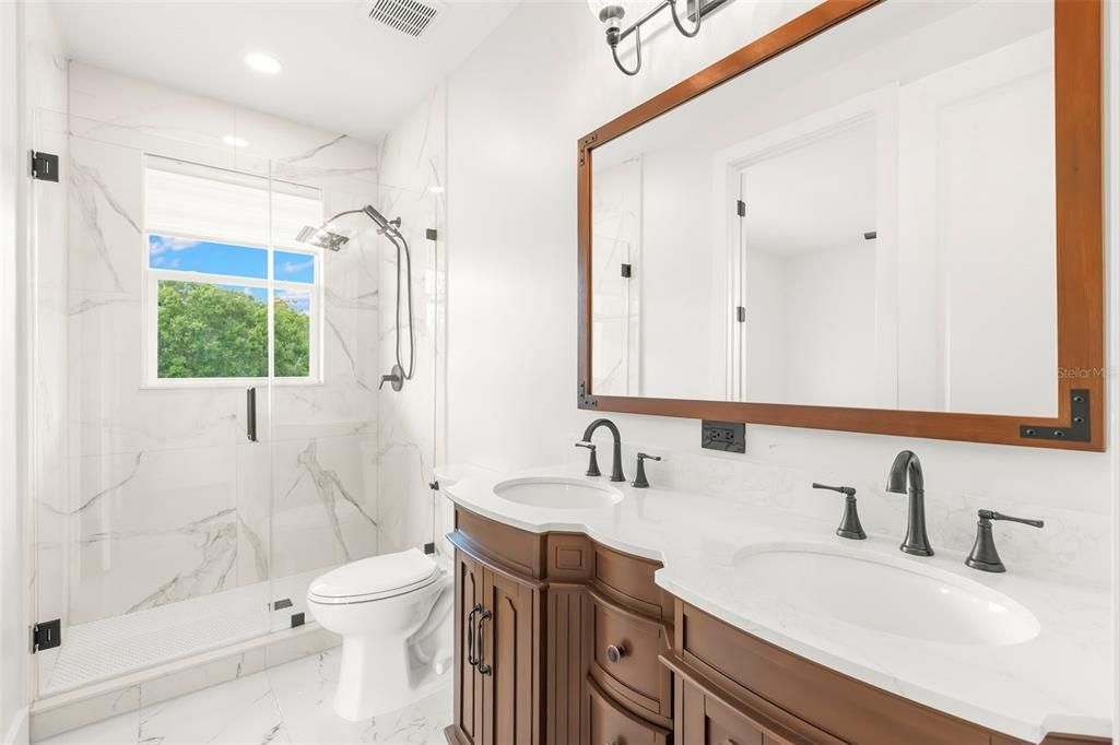 Bathroom, Dual Sink Vanities, Glass Shower, Interior, Marble, Marble Walls, Recessed Lighting