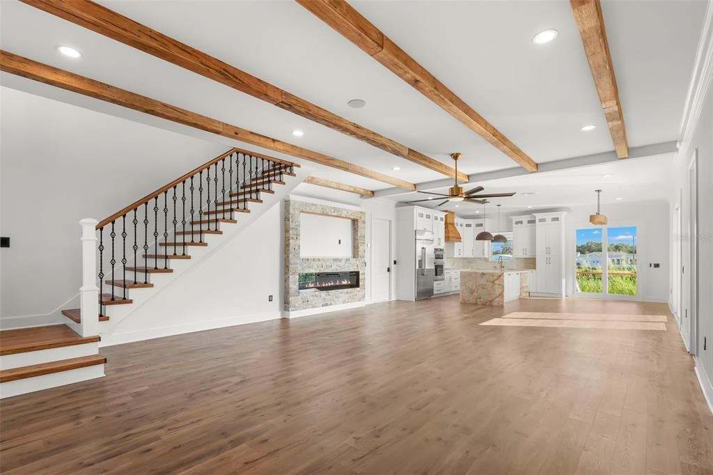 Empty room, Fireplace, Interior, Pendant Lights, Recessed Lighting, Wooden Beams, Wood Texture Flooring