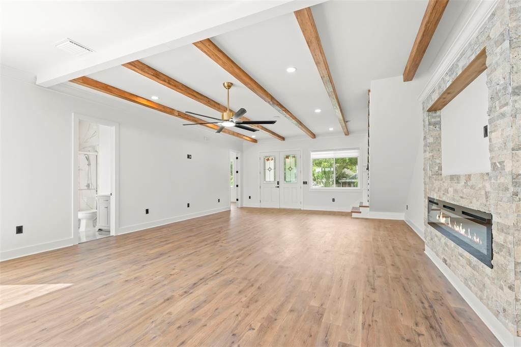 Empty room, Fireplace, Interior, Recessed Lighting, Wooden Beams, Wood Texture Flooring