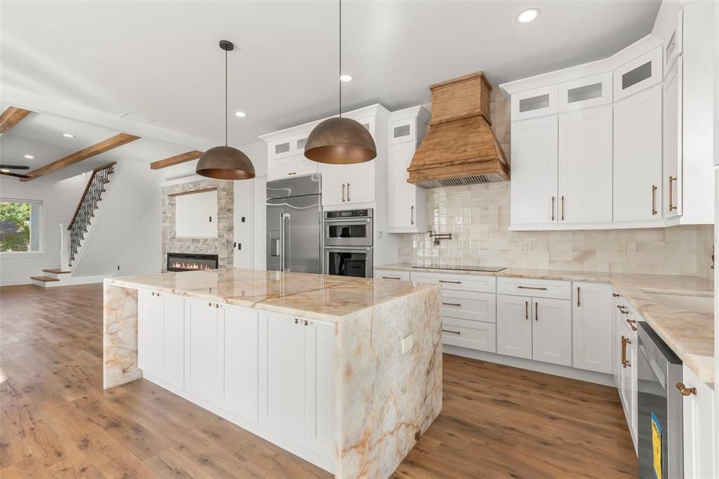 Fireplace, Interior, Kitchen, Pendant Lights, Recessed Lighting, Stainless Steel Appliances, Wooden Beams, Wood Texture Flooring