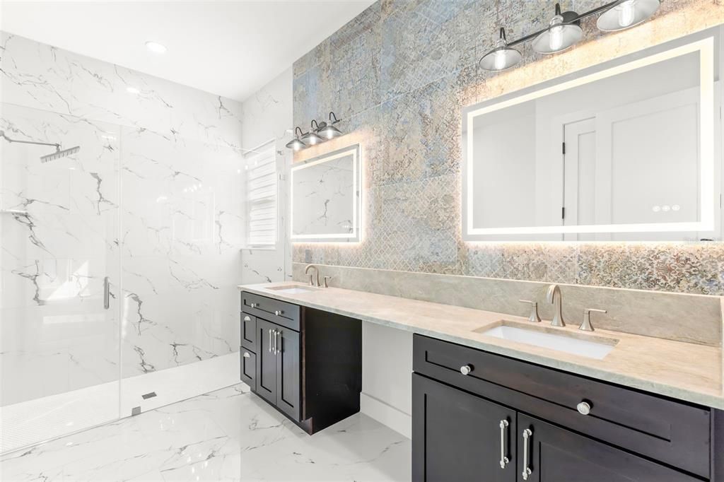 Bathroom, Dual Sink Vanities, Glass Shower, Interior, Marble, Marble Walls, Recessed Lighting