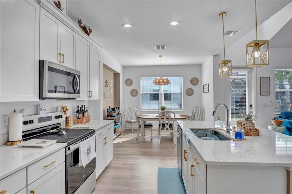 Dining room, Interior, Kitchen, Pendant Lights, Recessed Lighting, Stainless Steel Appliances, Wood Texture Flooring