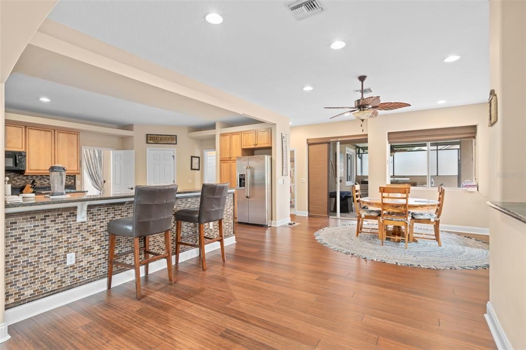 Dining room, Interior, Kitchen, Recessed Lighting, Stainless Steel Appliances, Wood Texture Flooring