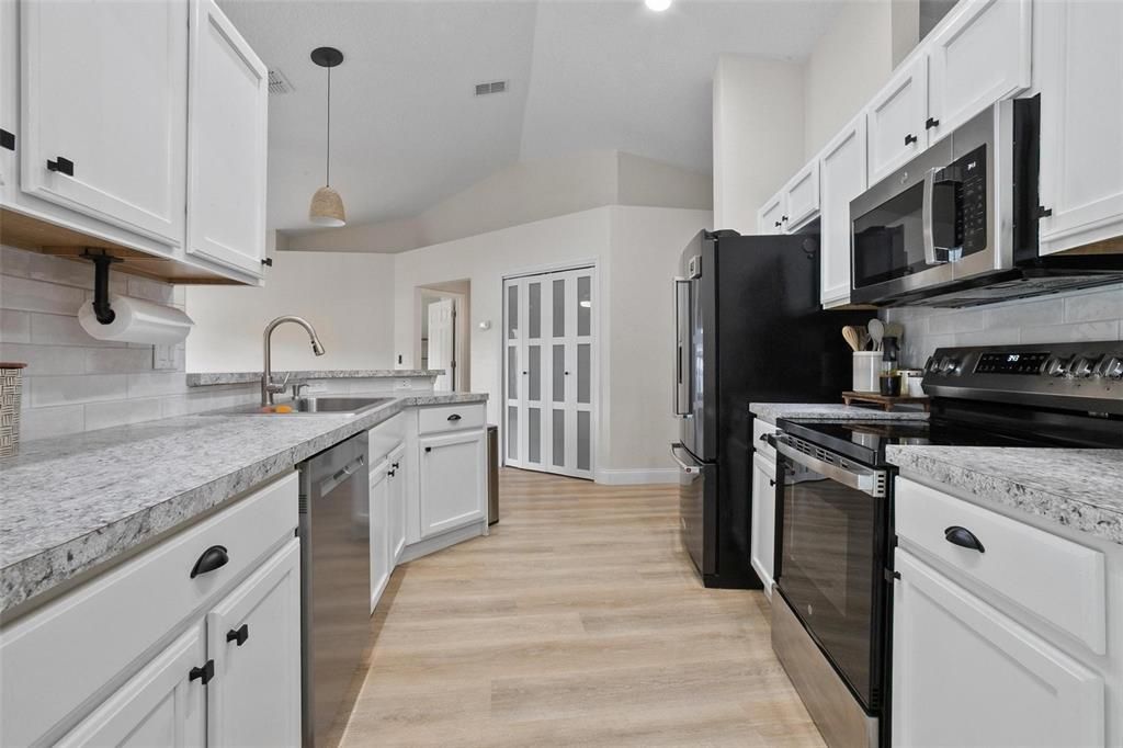 Interior, Kitchen, Pendant Lights, Recessed Lighting, Stainless Steel Appliances, Wood Texture Flooring