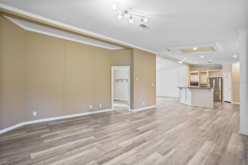 Empty room, Interior, Kitchen, Recessed Lighting, Stainless Steel Appliances, Wood Texture Flooring