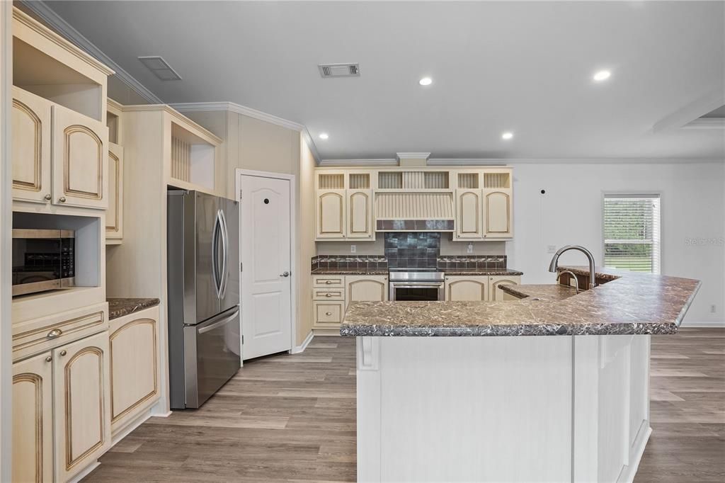 Interior, Kitchen, Recessed Lighting, Stainless Steel Appliances, Wood Texture Flooring