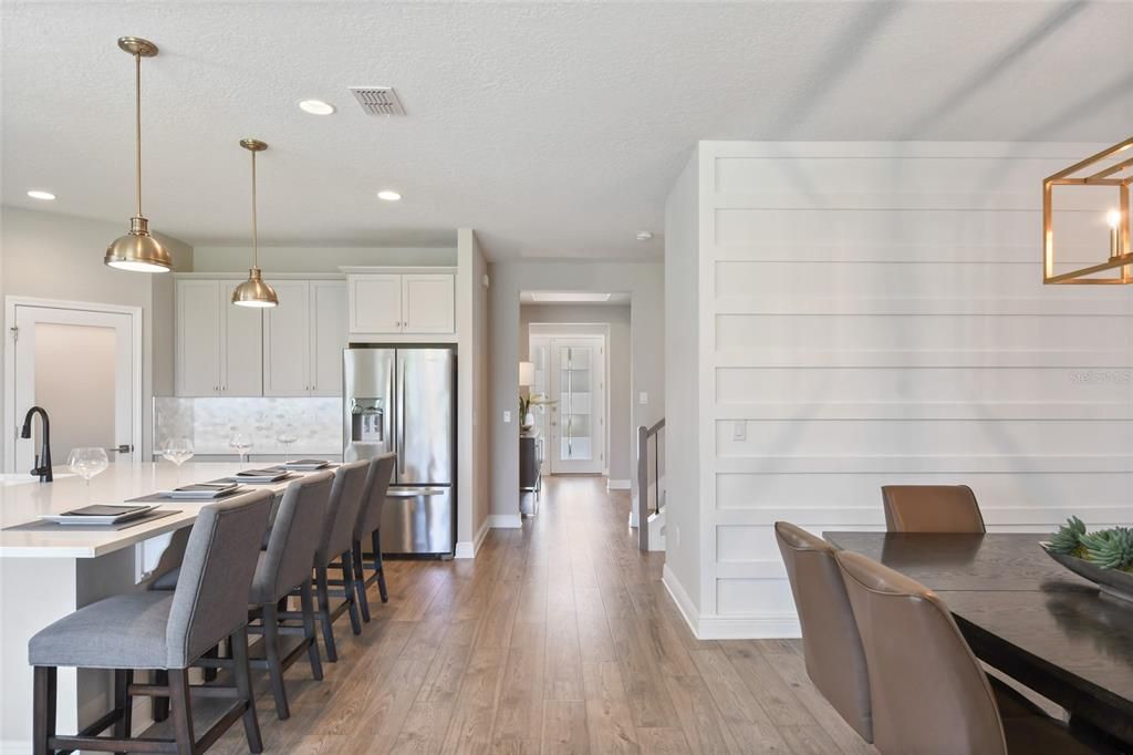 Dining room, Interior, Kitchen, Pendant Lights, Recessed Lighting, Stainless Steel Appliances, Wood Texture Flooring