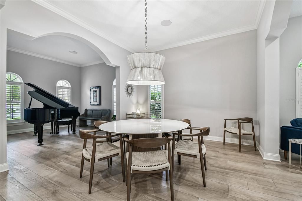 Dining room, Interior, Pendant Lights, Piano, Wood Texture Flooring