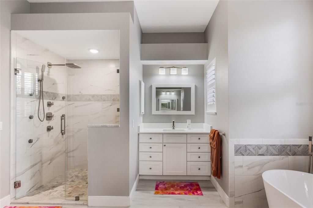 Bathroom, Dual Sink Vanities, Free Standing Baths, Glass Shower, Interior, Marble Walls, Recessed Lighting