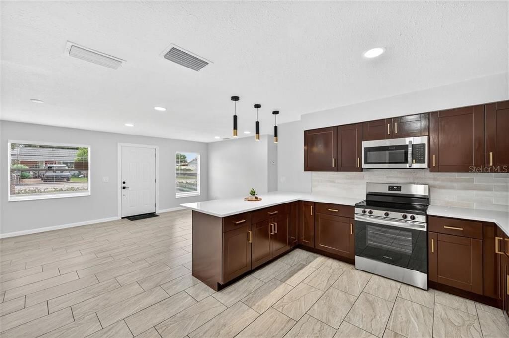 Interior, Kitchen, Pendant Lights, Recessed Lighting, Stainless Steel Appliances, Wood Texture Flooring
