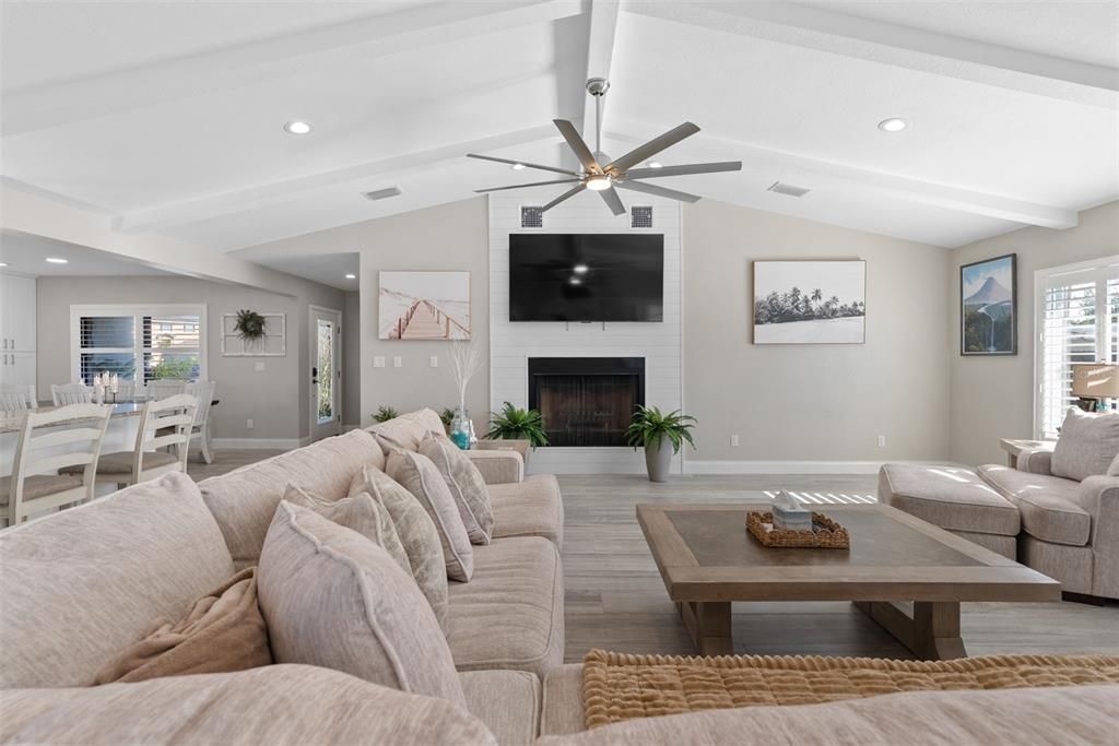 Dining room, Fireplace, Interior, Living room, Recessed Lighting, Wood Texture Flooring