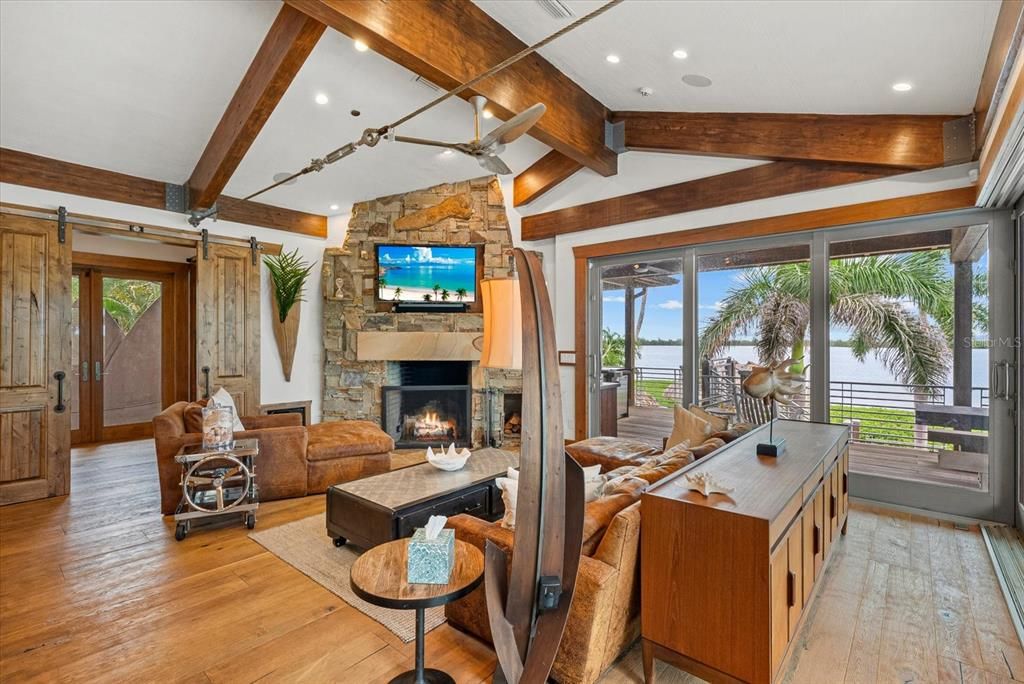 Fireplace, Interior, Living room, Recessed Lighting, Stone Walls, Water, Wooden Beams, Wood Texture Flooring