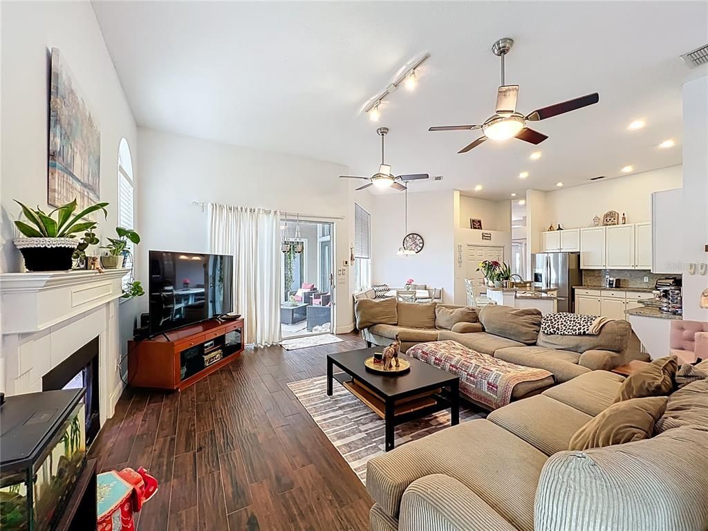Fireplace, Interior, Kitchen, Living room, Recessed Lighting, Stainless Steel Appliances, Wood Texture Flooring