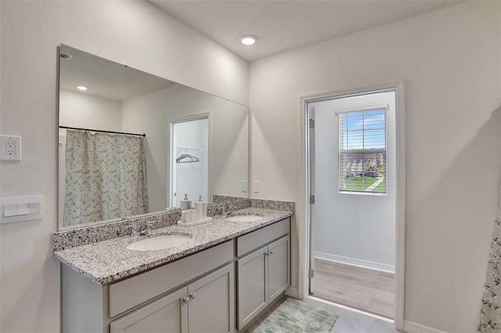Bathroom, Dual Sink Vanities, Interior, Recessed Lighting, Wood Texture Flooring