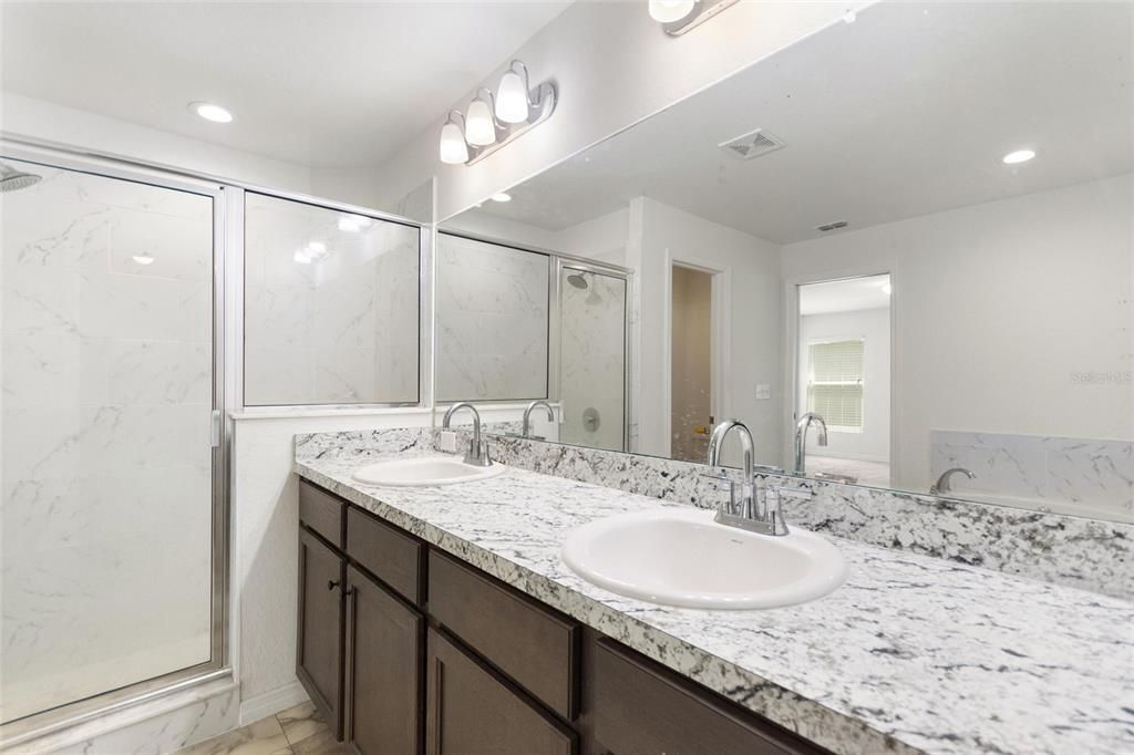 Bathroom, Dual Sink Vanities, Interior, Marble, Marble Walls, Recessed Lighting