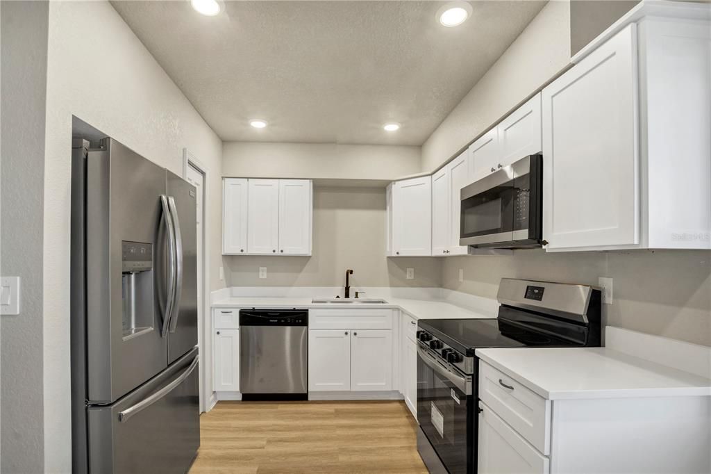 Interior, Kitchen, Recessed Lighting, Stainless Steel Appliances, Wood Texture Flooring