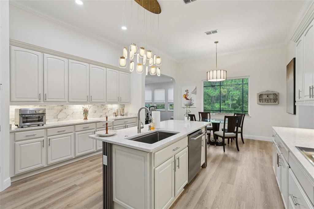 Dining room, Interior, Kitchen, Pendant Lights, Recessed Lighting, Stainless Steel Appliances, Wood Texture Flooring