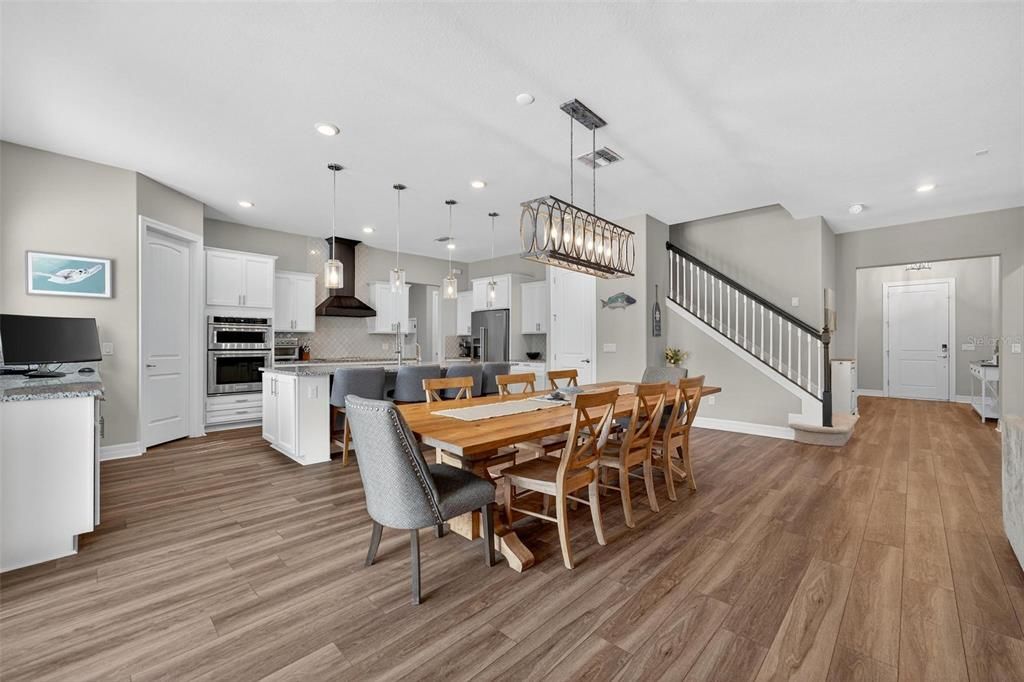 Dining room, Interior, Kitchen, Pendant Lights, Recessed Lighting, Stainless Steel Appliances, Wood Texture Flooring