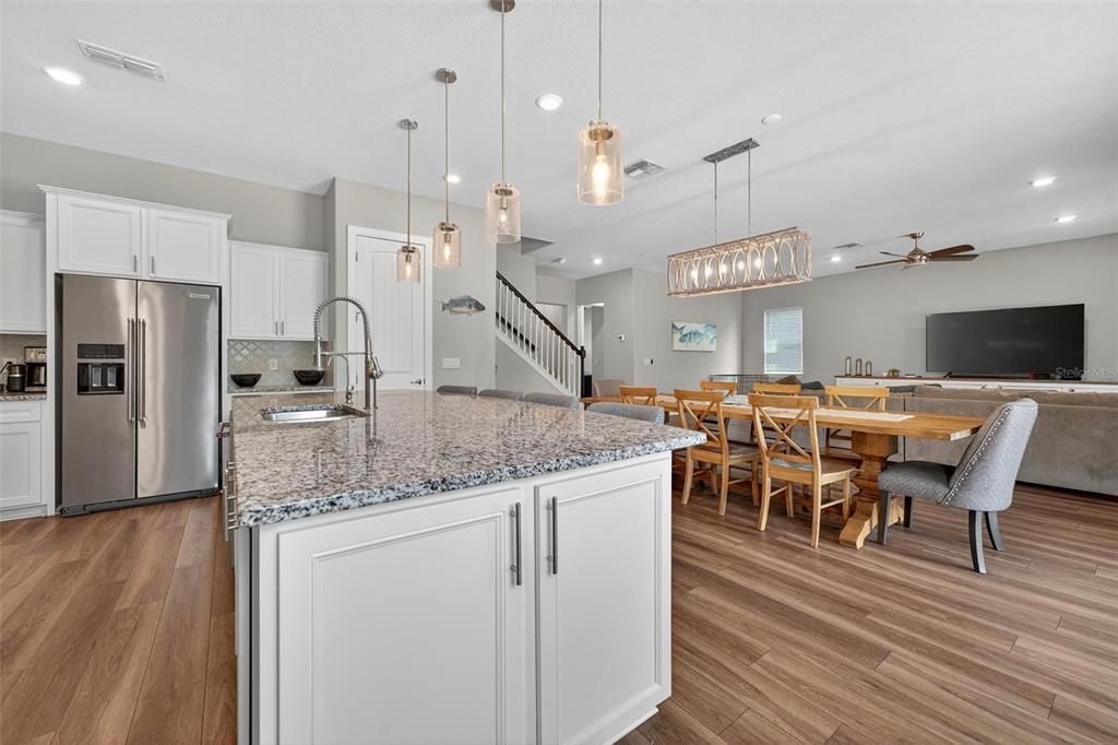 Dining room, Interior, Kitchen, Pendant Lights, Recessed Lighting, Stainless Steel Appliances, Wood Texture Flooring