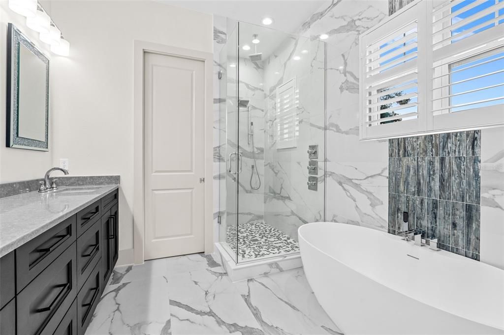 Bathroom, Free Standing Baths, Glass Shower, Interior, Marble, Marble Walls, Recessed Lighting