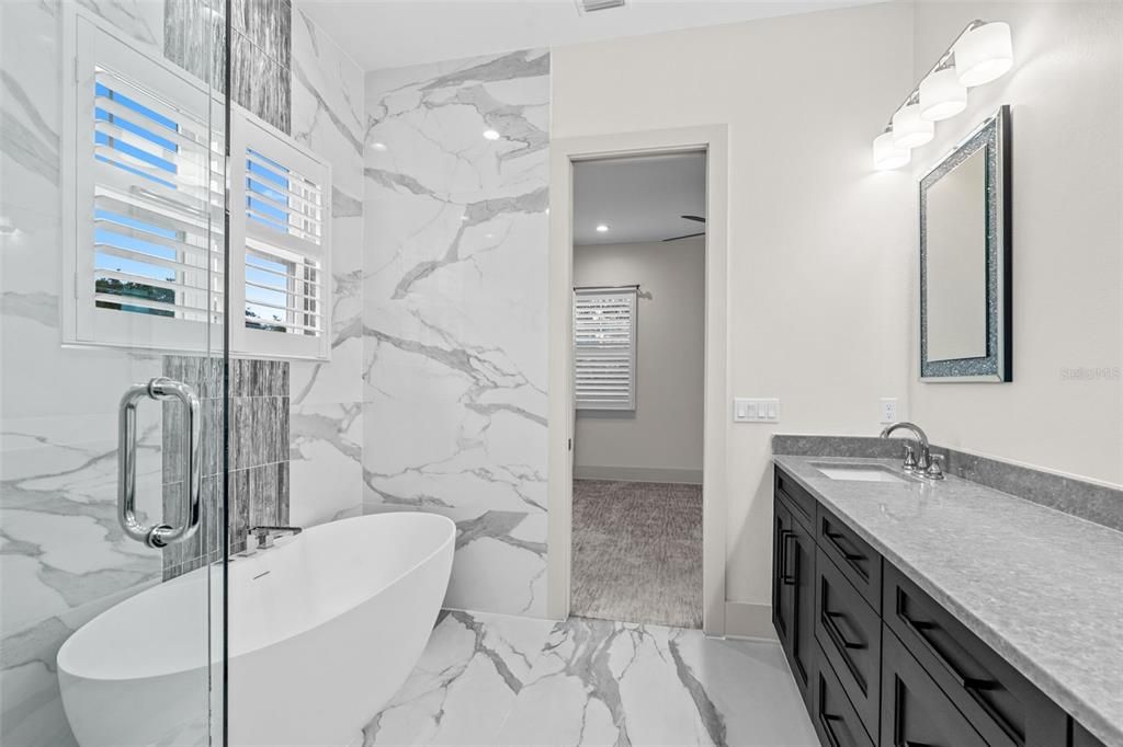 Bathroom, Dual Sink Vanities, Free Standing Baths, Glass Shower, Interior, Marble, Marble Walls, Recessed Lighting