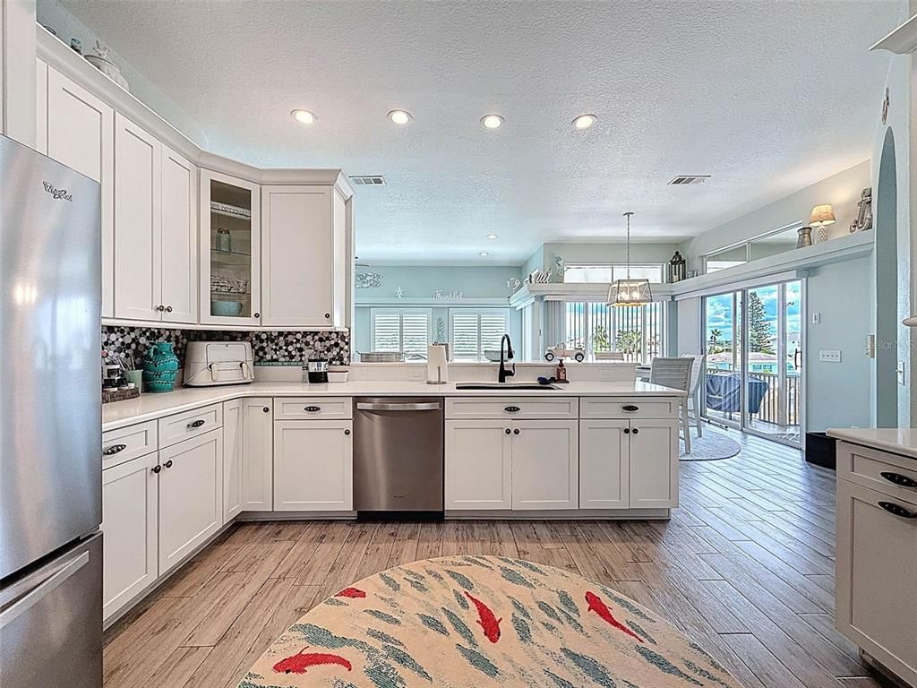 Chandelier, Dining room, Interior, Kitchen, Recessed Lighting, Stainless Steel Appliances, Wood Texture Flooring