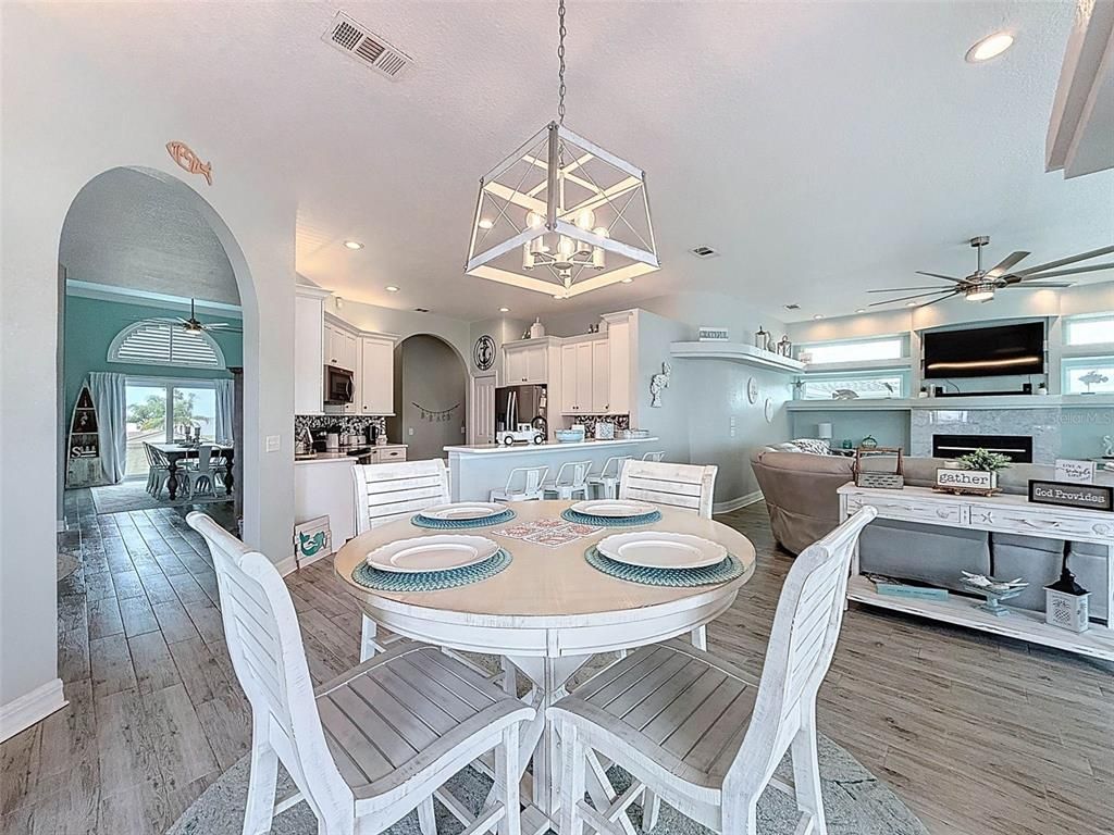 Dining room, Interior, Kitchen, Living room, Pendant Lights, Recessed Lighting, Stainless Steel Appliances, Wood Texture Flooring