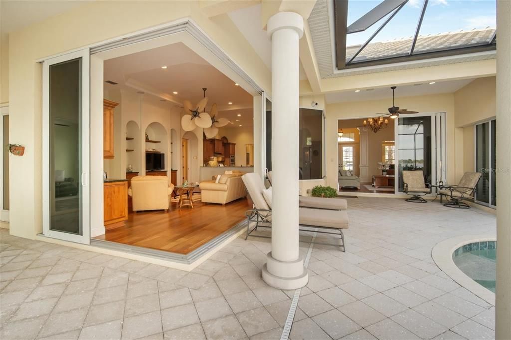 Chandelier, Glass Ceilings, Interior, Living room, Pool, Recessed Lighting, Wood Texture Flooring