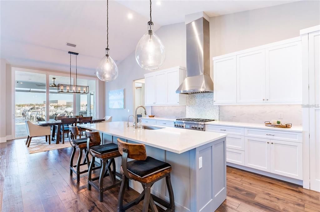 Dining room, Interior, Kitchen, Pendant Lights, Recessed Lighting, Stainless Steel Appliances, Water, Wood Texture Flooring