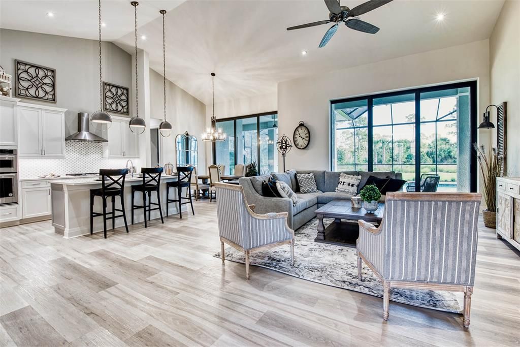 Dining room, Interior, Kitchen, Living room, Pendant Lights, Recessed Lighting, Stainless Steel Appliances, Wood Texture Flooring