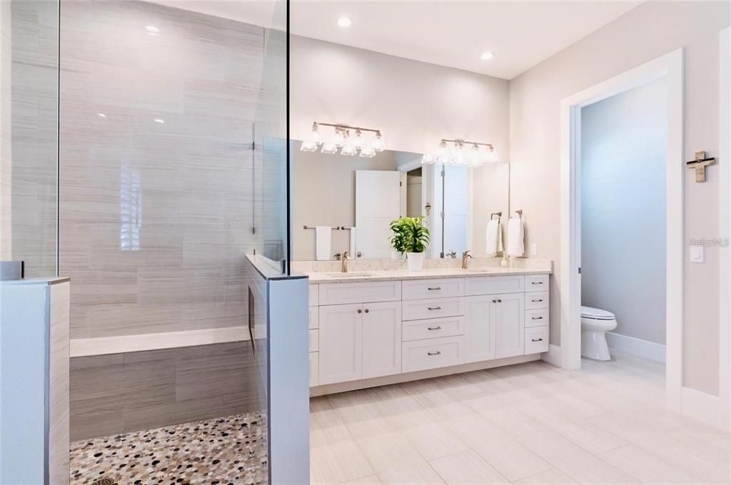 Bathroom, Dual Sink Vanities, Glass Shower, Interior, Recessed Lighting, Wood Texture Flooring