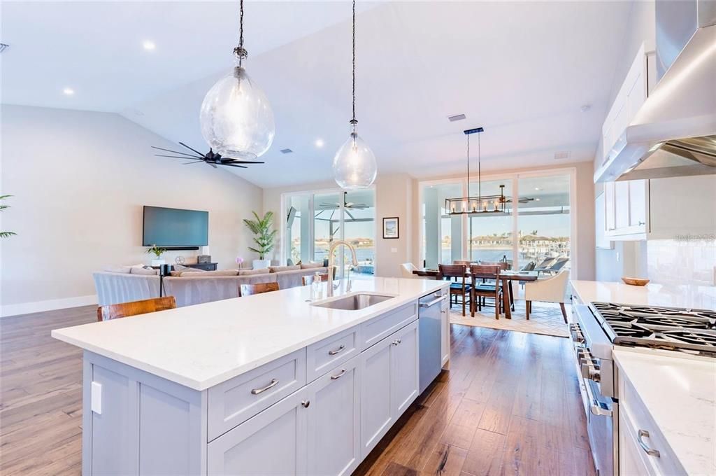 Dining room, Interior, Kitchen, Living room, Pendant Lights, Recessed Lighting, Stainless Steel Appliances, Wood Texture Flooring