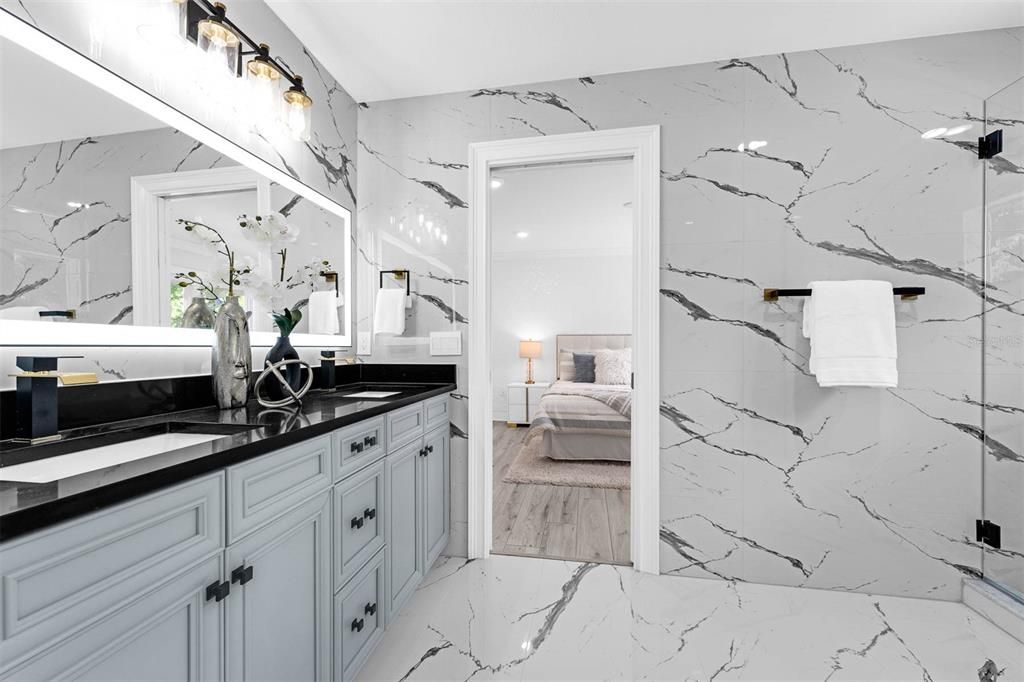 Bathroom, Bedroom, Dual Sink Vanities, Glass Shower, Interior, Marble, Marble Walls, Recessed Lighting, Wood Texture Flooring