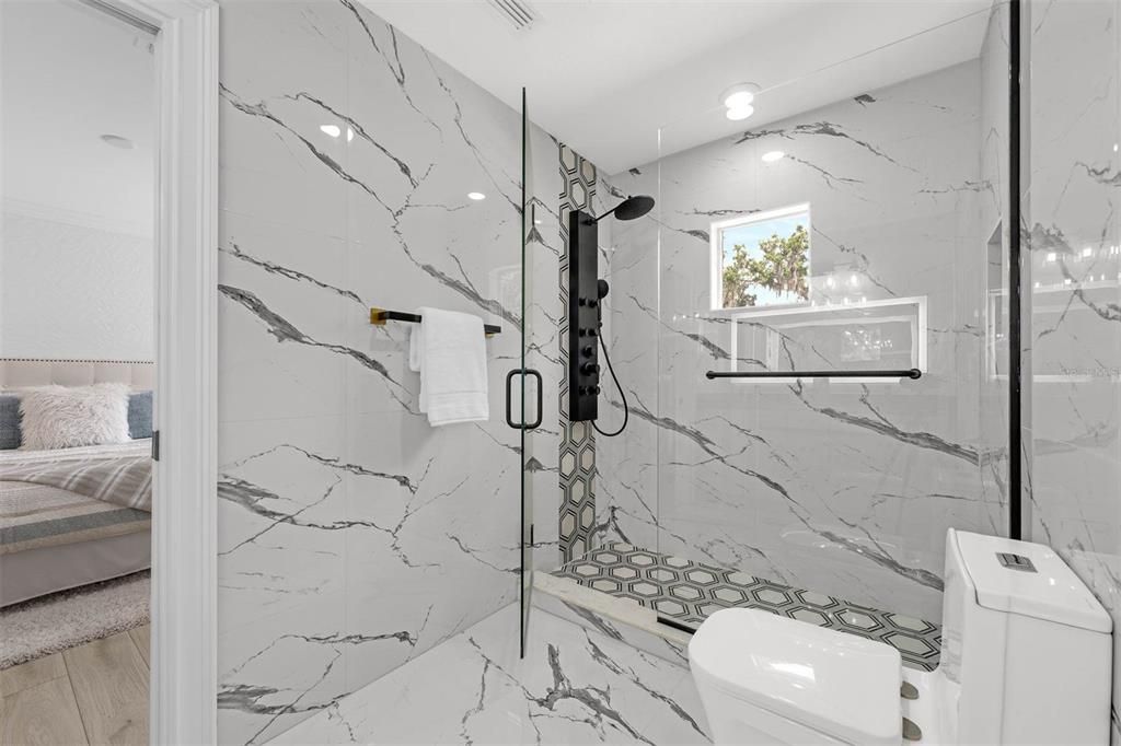 Bathroom, Bedroom, Glass Shower, Interior, Marble Walls, Recessed Lighting, Wood Texture Flooring