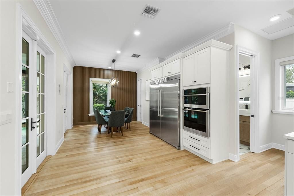 Dining room, Interior, Kitchen, Pendant Lights, Recessed Lighting, Stainless Steel Appliances, Wood Texture Flooring